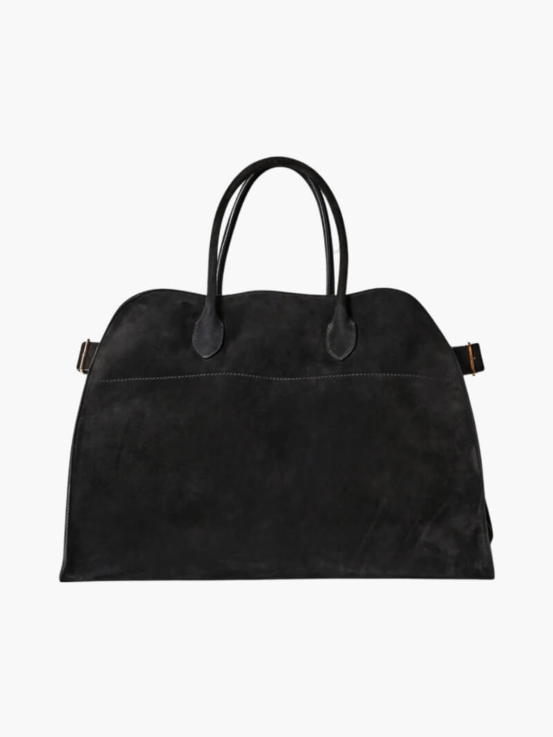 Elegant damväska i vegetabiliskt läder med rymlig design