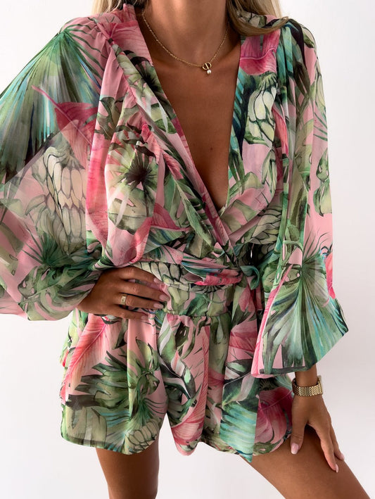 Playsuit i somrig stil med tropiskt tryck